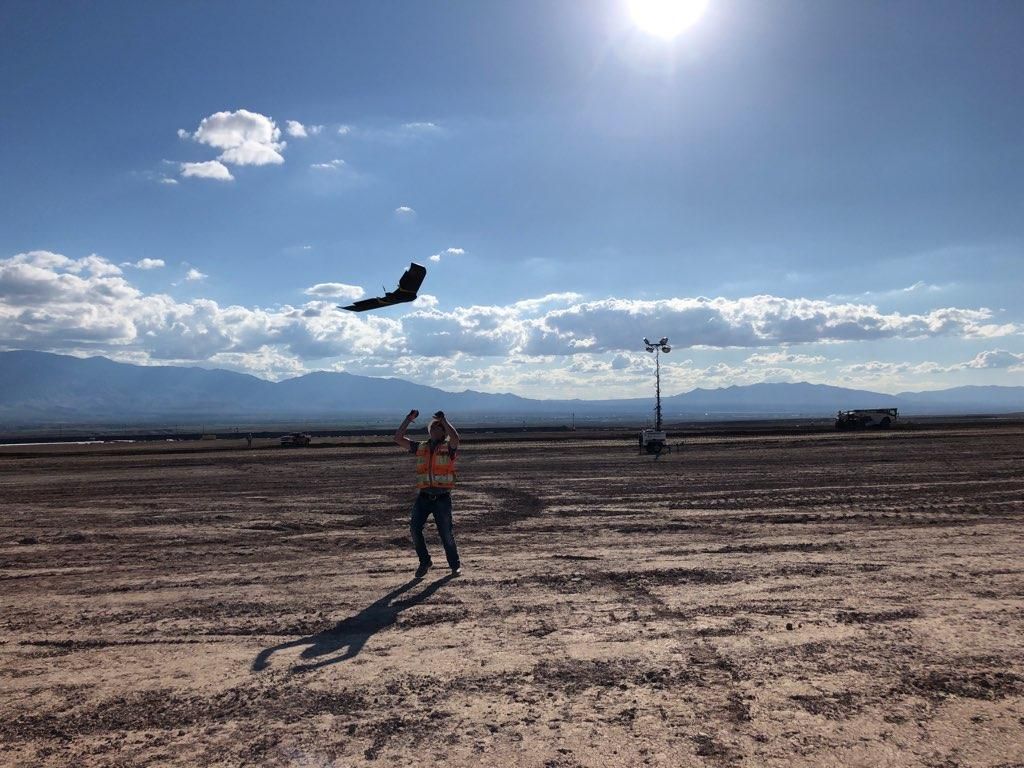 Ames Construction surveyor catching senseFly's eBee X after a successful data capture.