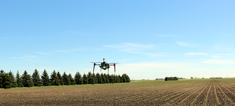 Drone flying over field